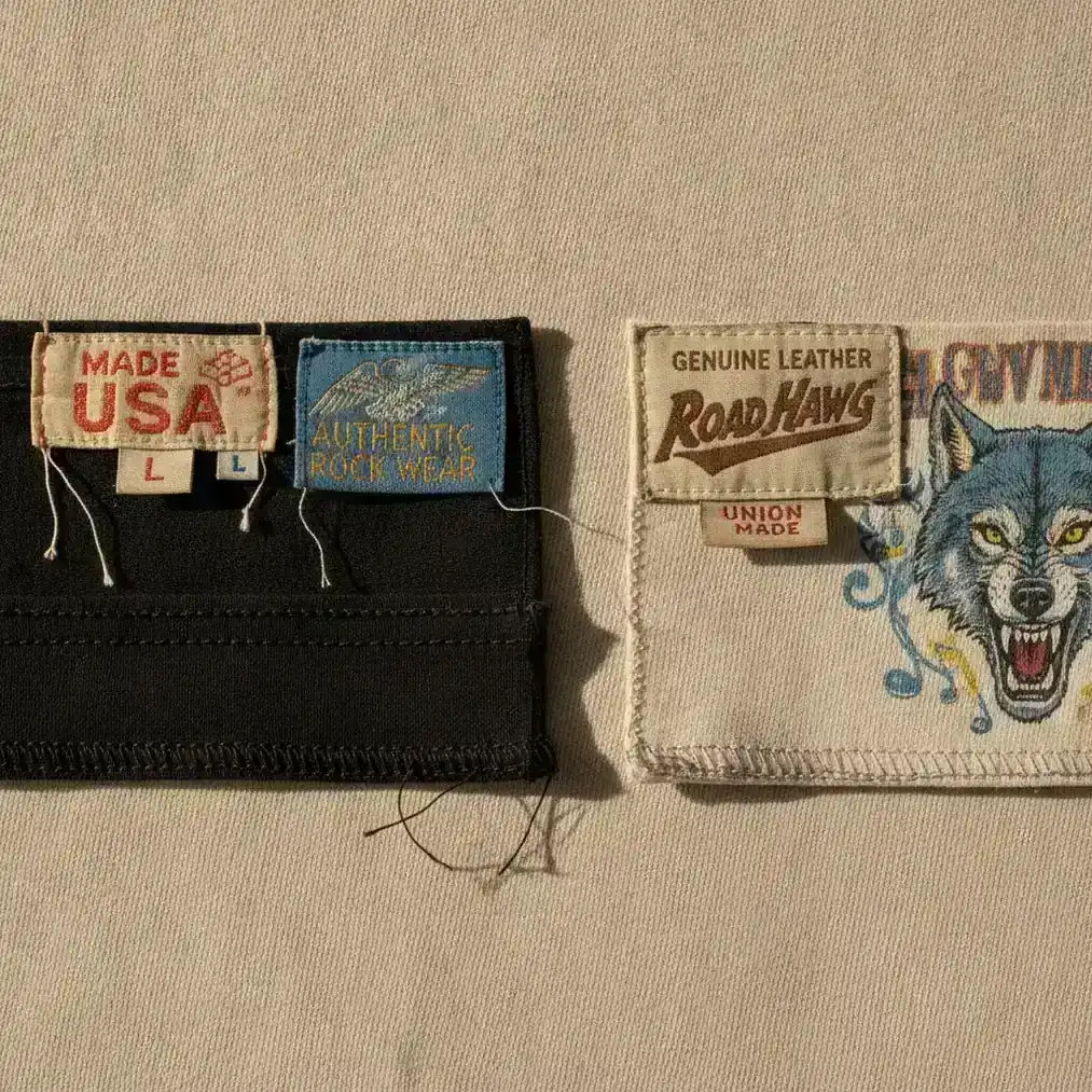 Close-up comparison of vintage clothing tags, stitching, and licensed band graphics
